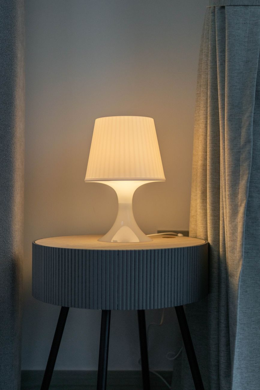 A lamp in a Dubai interior — the part of the move that only works once DEWA says so