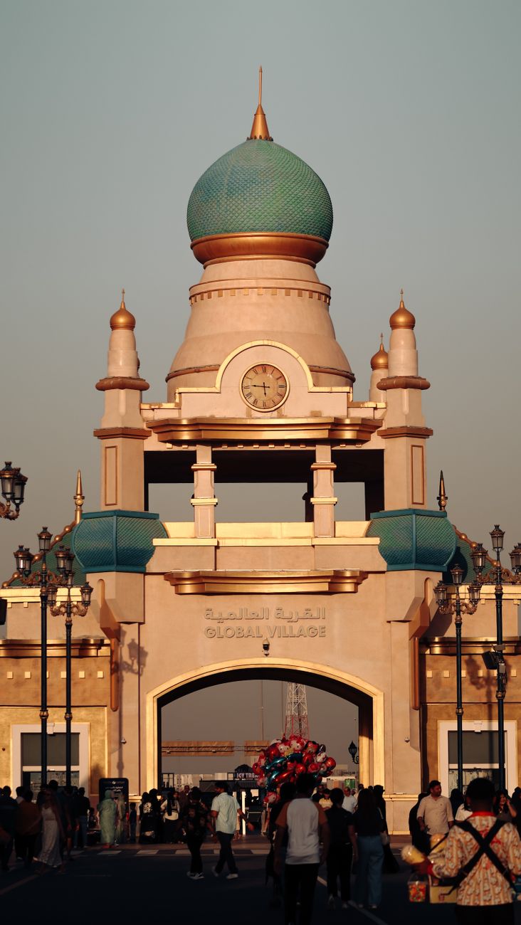 The main entrance gate of Global Village Dubai at sunset
