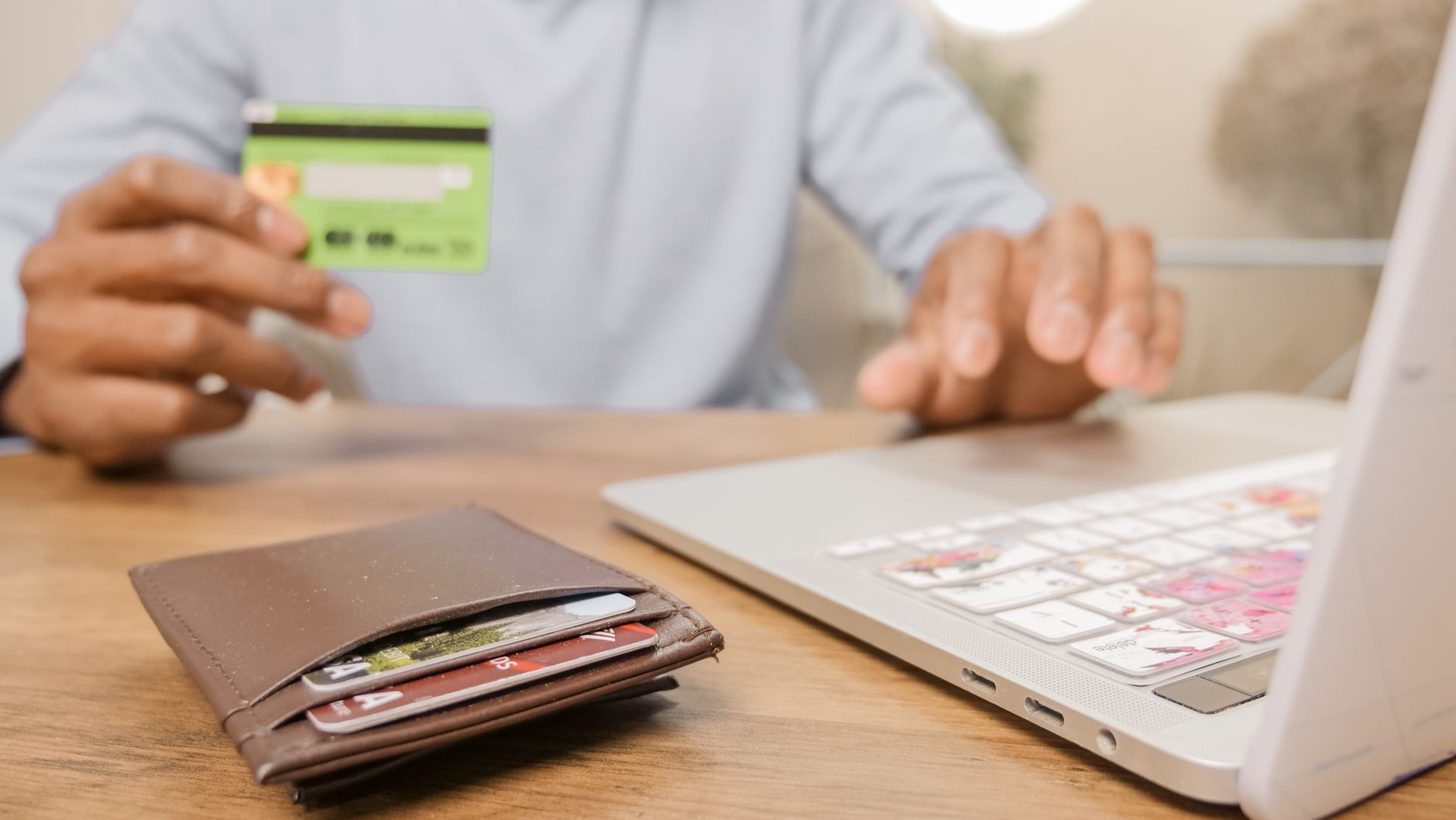 Card and laptop — most UAE banks now open resident accounts through their apps
